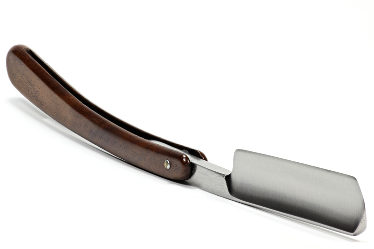 A straight razor with dark wooden scales on a white background