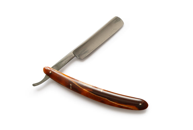 A straight razor with reddish-brown with a hint of yellow scales 