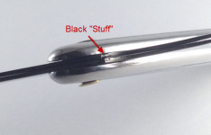 Image of a black substance on a Parker SR1 where the blade arms meet the handle.